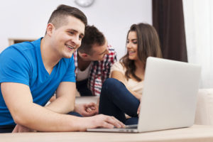 Sober roommates on computer in Boston Massachusetts