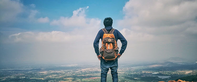 man in backpack thinking about addiction recovery programs