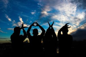 sober community group in Boston Massachusetts with love hand gestures