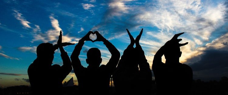 sober community group in Boston Massachusetts with love hand gestures