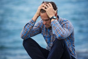 Man Thinking About Alternatives for Alcohol and Drugs While Stressed