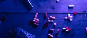 Table with addictive substances under black light
