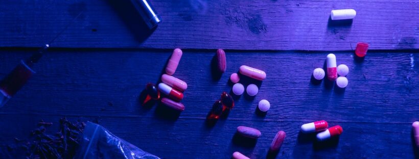 Table with addictive substances under black light