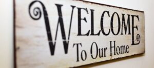 Sign on sober living house 'Welcome To Our Home'.